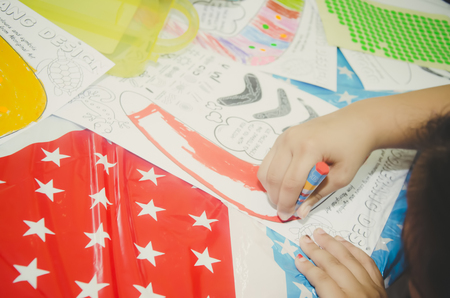 KUALA LUMPUR, MALAYSIA - NOVEMBER 5, 2016 : Close up preschool kids drawing with colorful pencils.のeditorial素材