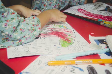 KUALA LUMPUR, MALAYSIA - NOVEMBER 5, 2016 : Close up preschool kids drawing with colorful pencils.のeditorial素材