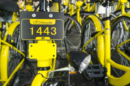 KUALA LUMPUR, MALAYSIA - September 9, 2017 : OFO bicycle close up. Founded in 2014 at China, OFO first in the world to introduce "non-docking" bike sharing platform operated by smartphone application.のeditorial素材