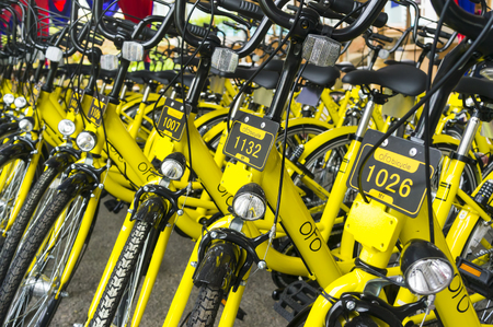 KUALA LUMPUR, MALAYSIA - September 9, 2017 : OFO bicycle close up. Founded in 2014 at China, OFO first in the world to introduce "non-docking" bike sharing platform operated by smartphone application.のeditorial素材