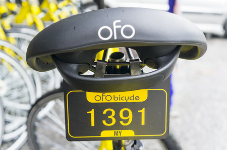 KUALA LUMPUR, MALAYSIA - September 9, 2017 : OFO bicycle close up. Founded in 2014 at China, OFO first in the world to introduce "non-docking" bike sharing platform operated by smartphone application.のeditorial素材