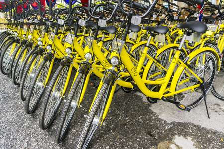 KUALA LUMPUR, MALAYSIA - September 9, 2017 : OFO bicycle close up. Founded in 2014 at China, OFO first in the world to introduce "non-docking" bike sharing platform operated by smartphone application.のeditorial素材