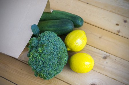 Healthy and nutrition eating. Fresh vegetables in paper bags. Vignette effect and selective focus.の写真素材