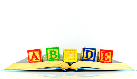 Close up arrangement of alphabet isolated on white background. Preschool, education concept or other your content.の写真素材
