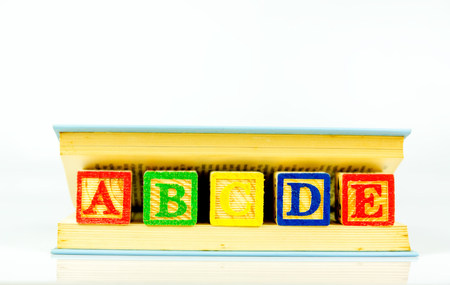 Close up arrangement of alphabet isolated on white background. Preschool, education concept or other your content.の写真素材
