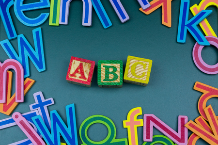 Close up arrangement of alphabet on green board. Preschool, education concept or other your content.の写真素材