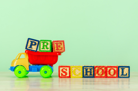 Colorful toy truck with alphabet blocks arrangement of Pre School. Pre school, back to school concept.の写真素材