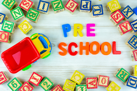 Truck toy and alphabet letters with arrangement of Pre School wording. Pre School, back to school and kindergarten concept.の写真素材