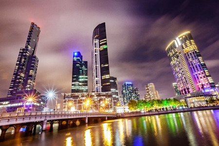 A view across the Yarra river atthe landmark of Melbourne downtown during the cityâs nightime.の写真素材