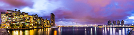 Panorama view of a beautiful view of docklands and The Bolte Bridge with a cloudy sky and twilight in Melbourne Australia.の写真素材