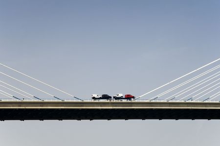 Truck with cars crossing a bridgeの写真素材