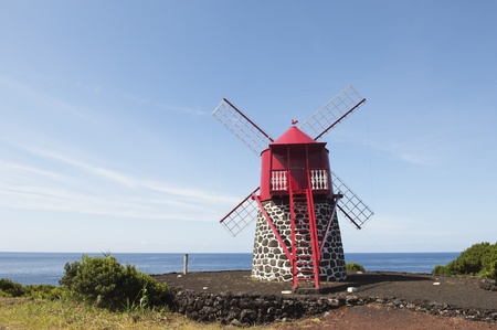 Red windmill in the coast of Pico island, Azoresの写真素材