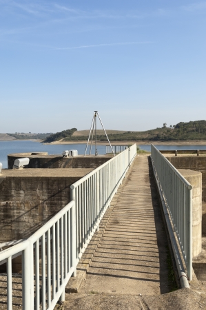 Footbridge accessing the penstocks of the overflow spillway in Vigia dam supplying drinking water to the county of Redondo, Alentejo, Portugalの写真素材