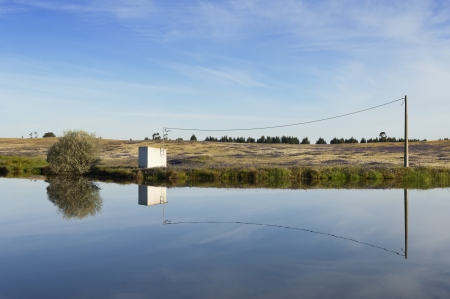 Shelter for irrigation water pump in the banks of a small pond, Alentejo, Portugalの写真素材