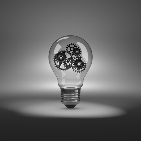 One Single Light Bulb with Metallic Gears Inside under Spotlight 3D Illustrationの写真素材