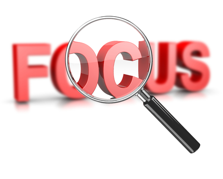 Magnifier Glass Focused on a Blurry Focus Red Text 3D Illustration on Whiteの写真素材