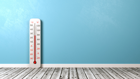 Thermometer on Wooden Floor Against Blue Wall with Copyspace 3D Illustrationの写真素材