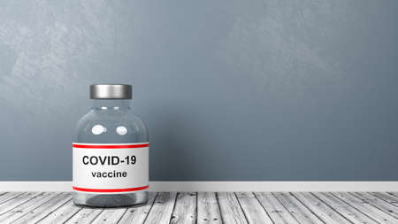 Covid 19 Vaccine Bottle on Wooden Floor in the Roomの写真素材