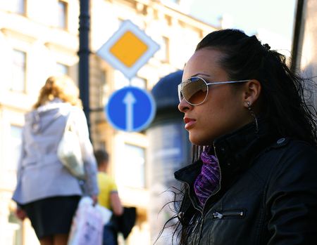 Lonely, beautiful girl waiting for her love in the big city.の写真素材