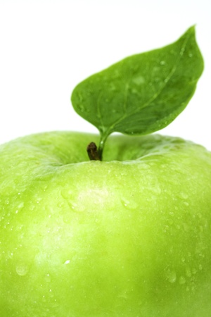 Photo of a ripe green apple, isolated on a white backgroundの写真素材