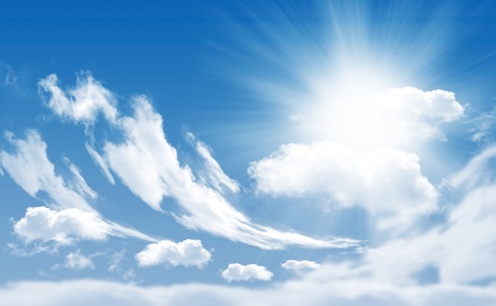 Photo of clouds and sun in the background of a beautiful blue skyの写真素材