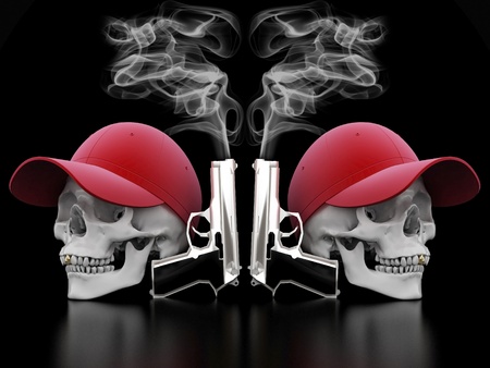 Image of a white skull with a gold tooth on a black backgroundの写真素材