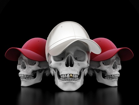 Image of a white skull with a gold tooth on a black backgroundの写真素材
