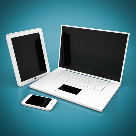 Laptop, tablet and smartphone on a blue backgroundの写真素材