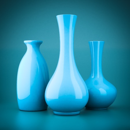 set of porcelain vases on a blue backgroundの写真素材