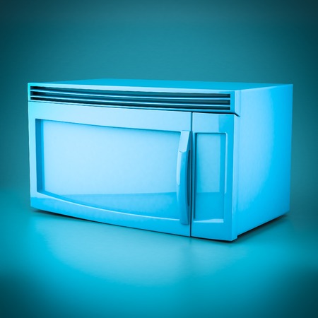 3D rendering microwave oven on a blue backgroundの写真素材