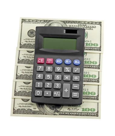 Calculator and dollars isolated on a white backgroundの写真素材
