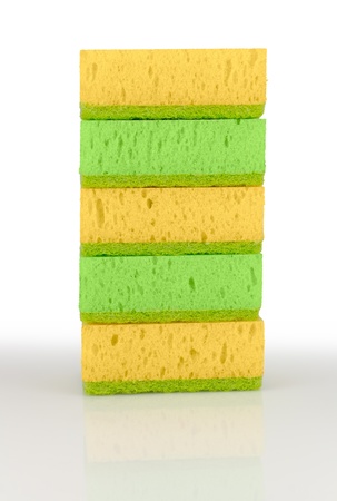 Five colored sponges. Isolated on white backgroundの写真素材
