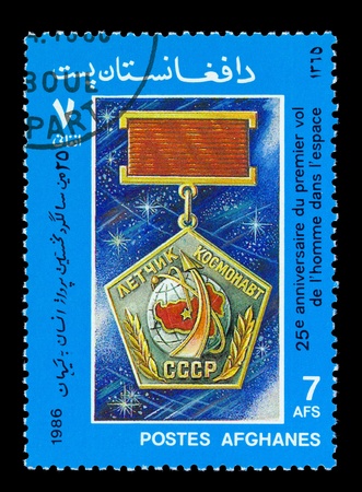 AFGHANES - CIRCA 1986: A stamp printed in Afghanes showing Medal "Pilot Astronaut USSR" circa 1986.の写真素材