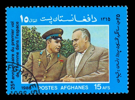 AFGHANES - CIRCA 1986: A stamp printed in the Afghanes shows Yury Gagarin and Sergey Koroliov, circa 1986の写真素材