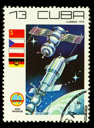 CUBA - CIRCA 1979: A vintage postal stamp printed in Cuba shows parachute with spacecraft capsule, circa 1979の写真素材