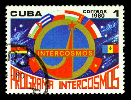 CUBA CIRCA 1980: A stamp printed in Cuba shows Intercosmos emblem, one stamp from series, circa 1980.の写真素材