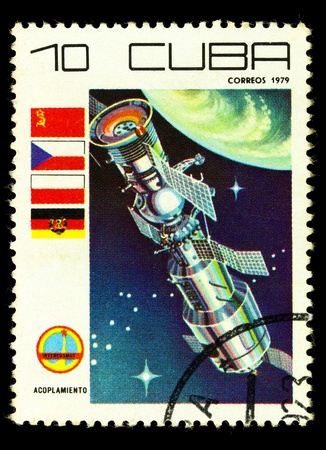CUBA - CIRCA 1979: A vintage postal stamp printed in Cuba with a postmark dated 1904, depicting a space satellite named Acoplamiento in orbit circa 1979の写真素材