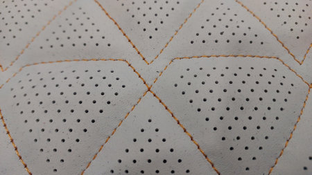Leather stitched with perforated pattern, texture or background