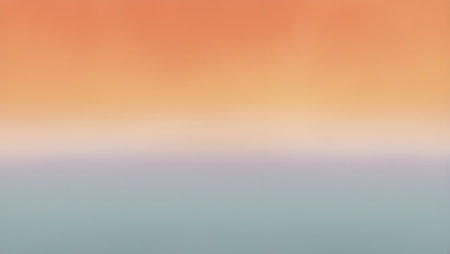 A minimalist gradient background transitioning from warm orange to cool blue huesの素材