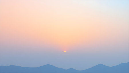 Gradient sunrise landscape with shades of pink, orange and lightの素材