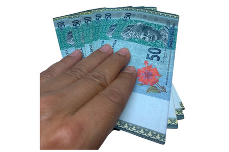 Hand pick Malaysian Ringgit (MYR) Banknote RM50 isolated on white background.