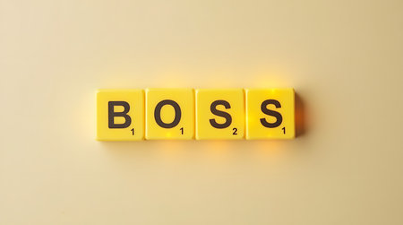 Empowering concept showing the word BOSS spelt out using yellow letter tilesの素材