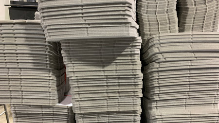 Stacks of gray foam padding arranged in neat layersの写真素材