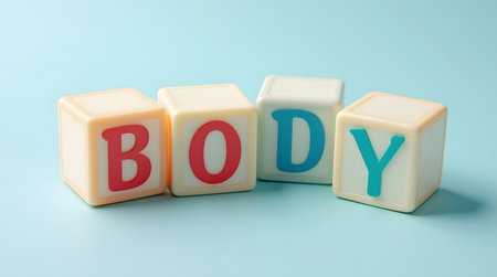 Engage children with colorful blocks that spell "BODY". Perfect for early learning and educational resources.の素材