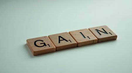 Achieve great business gains with focused strategy shown by game blocks on white backgroundの素材