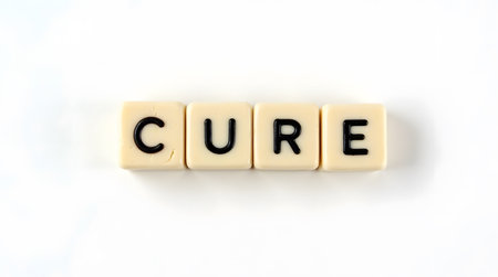 Hope for a cure spelled out with letter tiles on white backgroundの素材