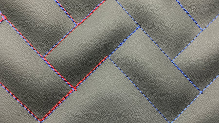 Beautiful thread stitching on the black leather.の素材