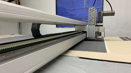 Precision fabric cutting with automated machine for textile manufacturing and garment industry...