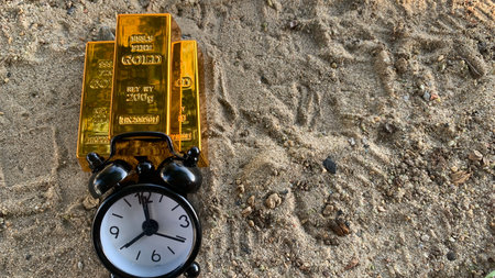gold bar and clock, suitable for  financial planning or investment, photo conceptの写真素材