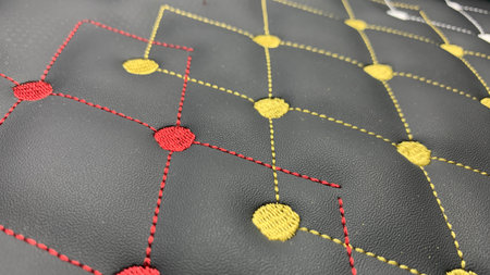Beautiful thread stitching and embroidery on the black leather.